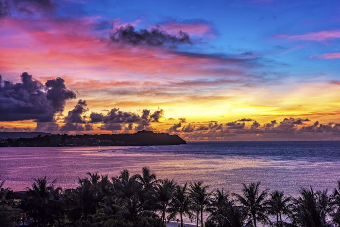 Sunset at Tumon Bay in Guam photo via Depositphotos