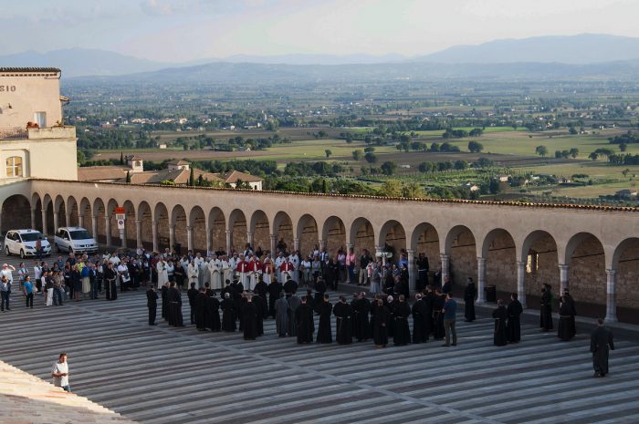 Priests preparing for a short procession just before sunset.