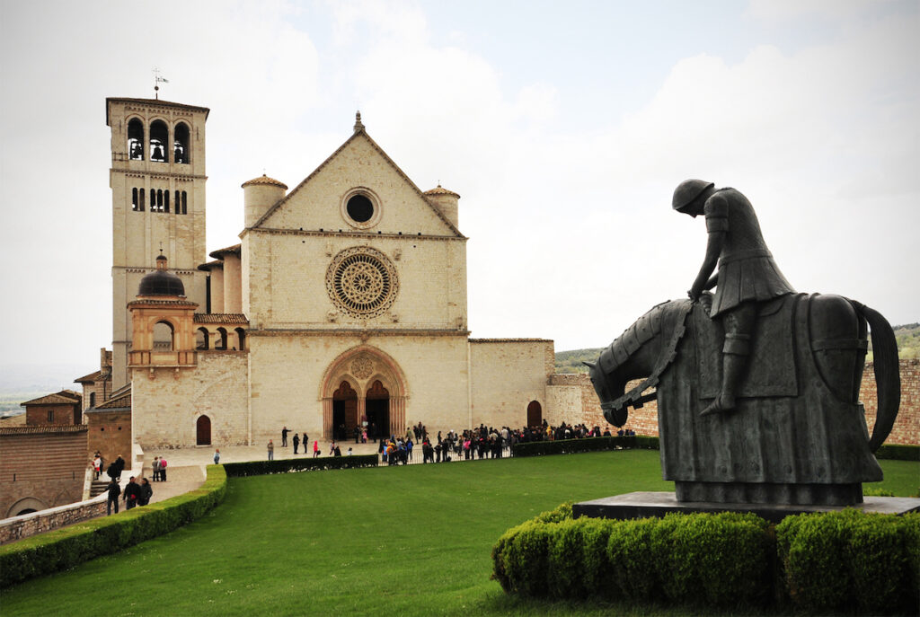 St. Francis astride his horse with head bowed after hearing the voice of God telling him to leave the war and return home.