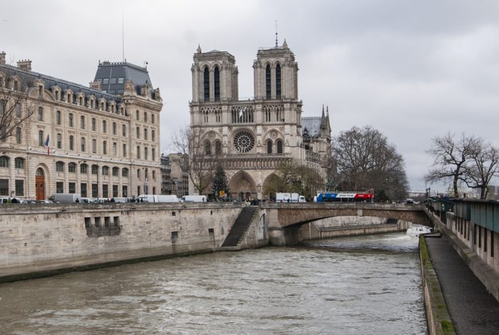 The Seine runs past the Cathedral that's built on an island which splits the river into two branches.