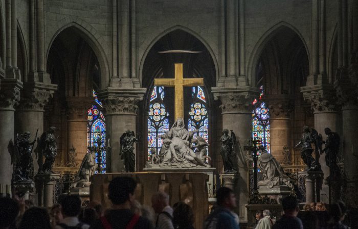 The altar has a simple golden Cross standing above the Pieta.