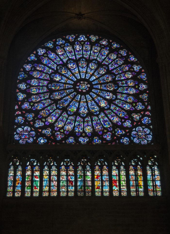 The stained glass rose window is one of the characteristics of Gothic architecture which brings light into the enormously tall interiors.