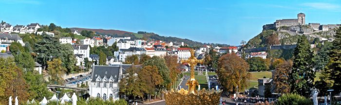 Panoramic view of Lourdes with the old Roman fort up on the hill.