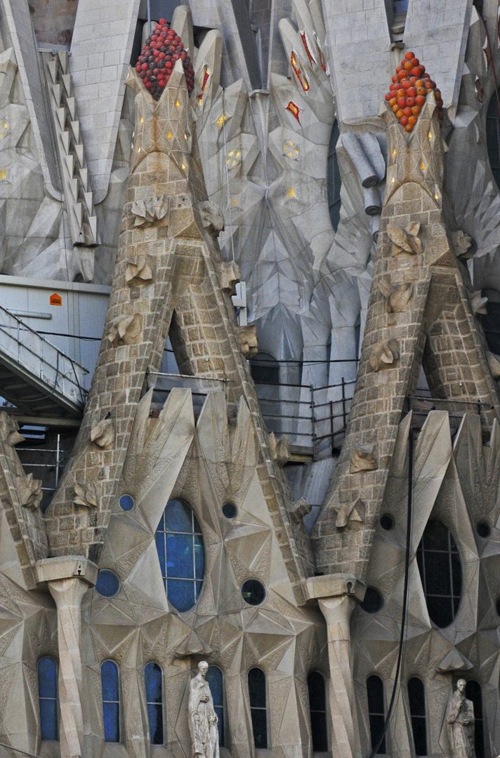 The pediments have Eucharistic symbols such as the grapes you can see used for making wine.