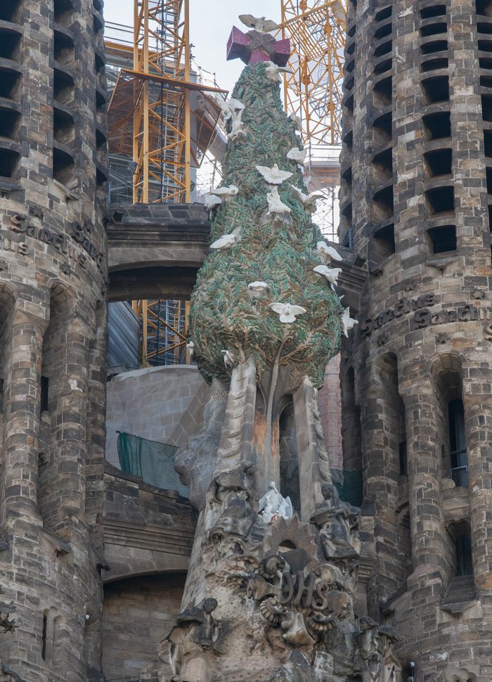 The Tree of Life - high above the doorway is a green ceramic cypress studded with white marble doves for peace. The dove at the top represents the faithful who turn to God.