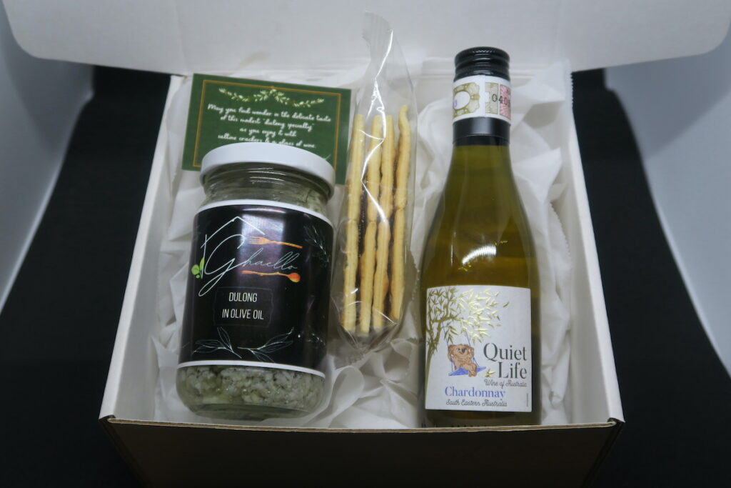 Ghaello’s signature Christmas Box Set, its contents include: a jar of Dulong in Olive Oil, crackers and a bottle of Australian wine