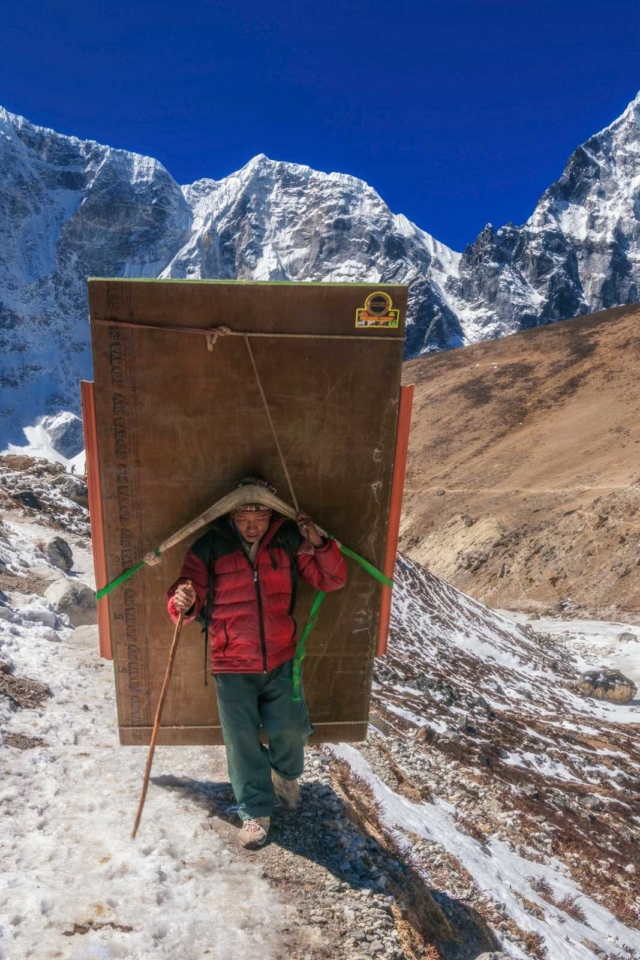 everest base camp trek Sherpas with load